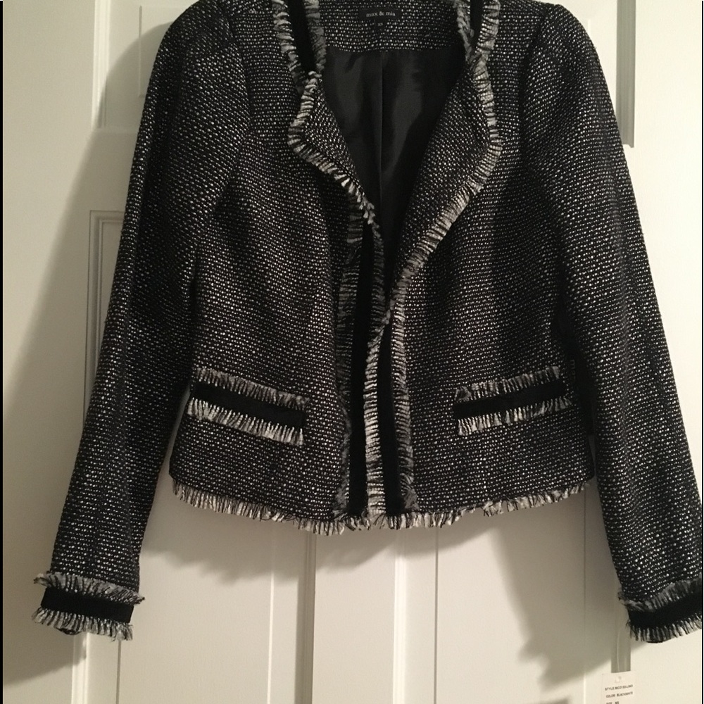 Black and white blazer.